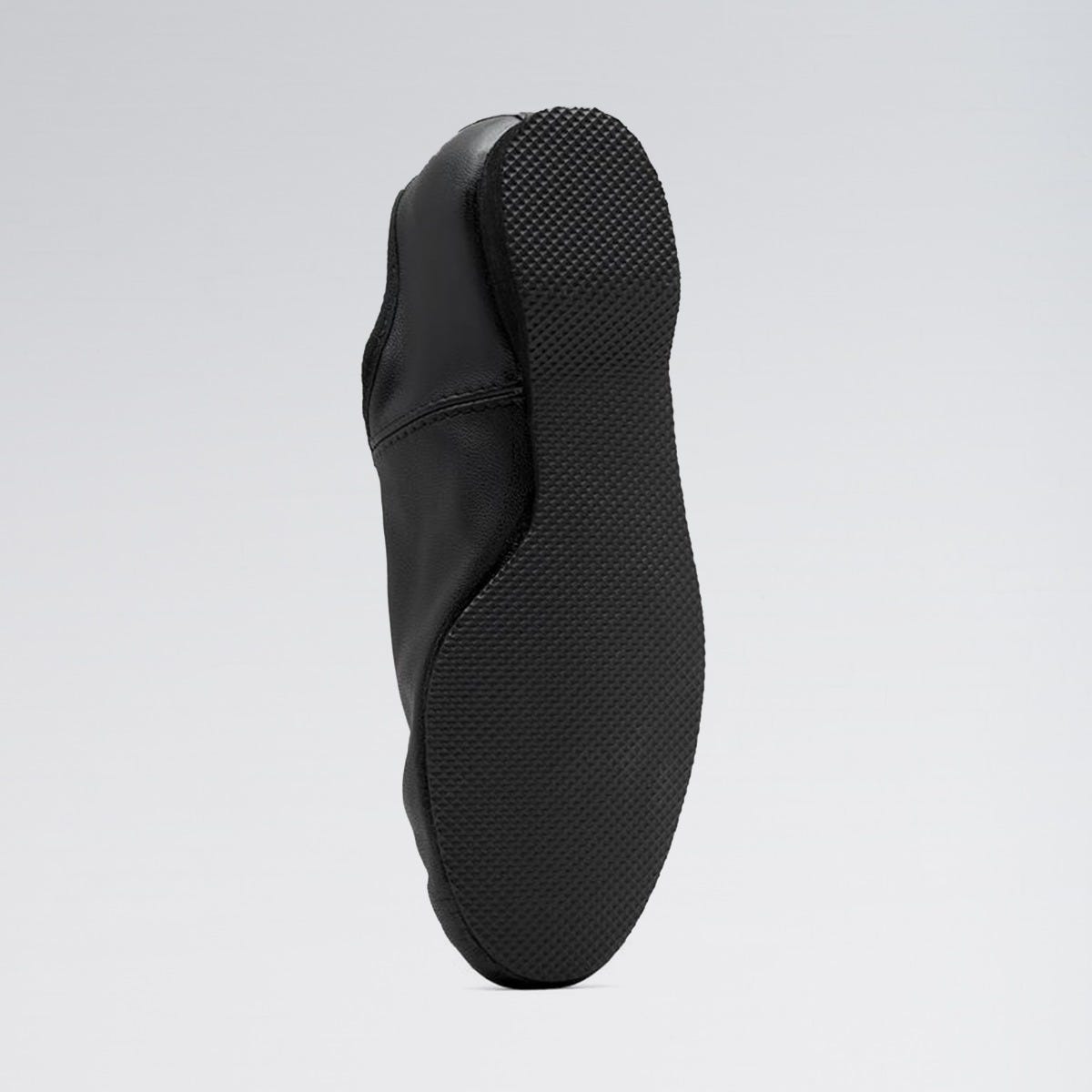 Black shoe sole on a light gray background