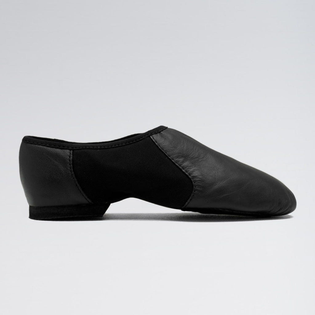 Black dance shoe on a light gray background