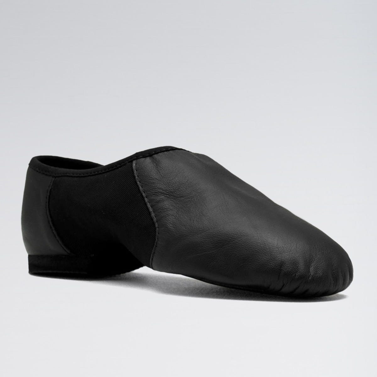 Black leather dance shoe on a light gray background
