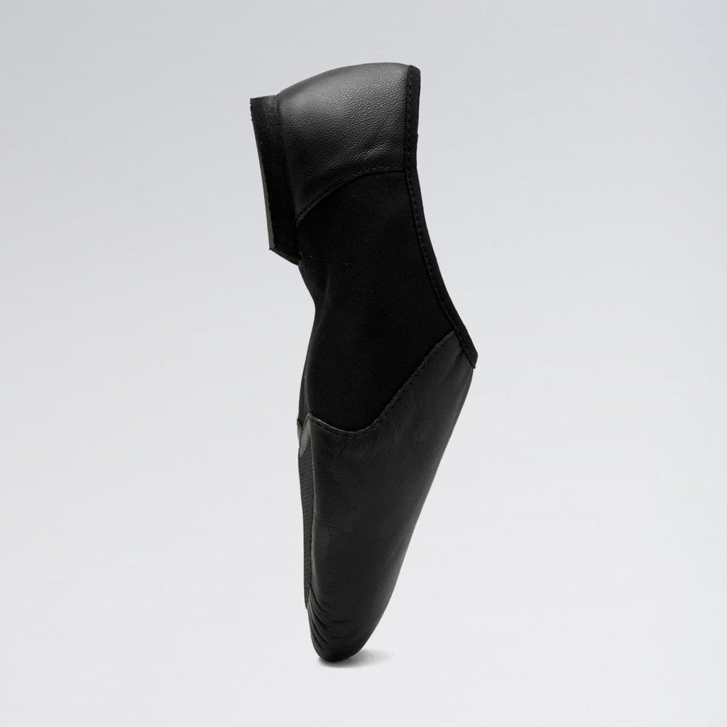 Black leather shoe on a light gray background