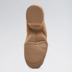 Tan slip-on shoe with sole on a light gray background