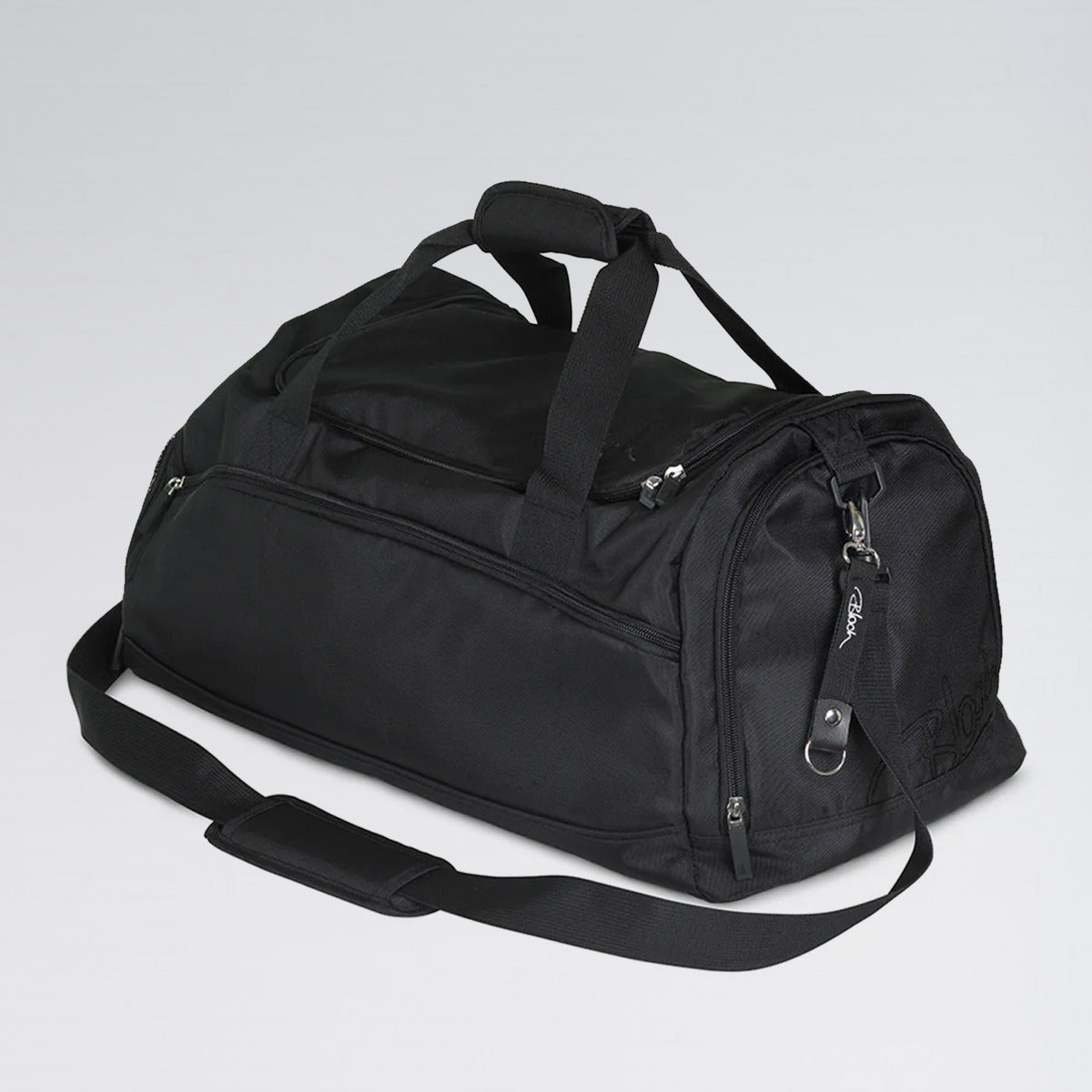Black duffel bag on a light gray background