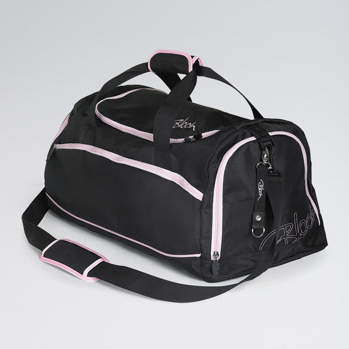 Black duffel bag with pink accents on a light gray background