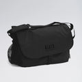 Black messenger bag with 'BLOCH' branding on a light gray background