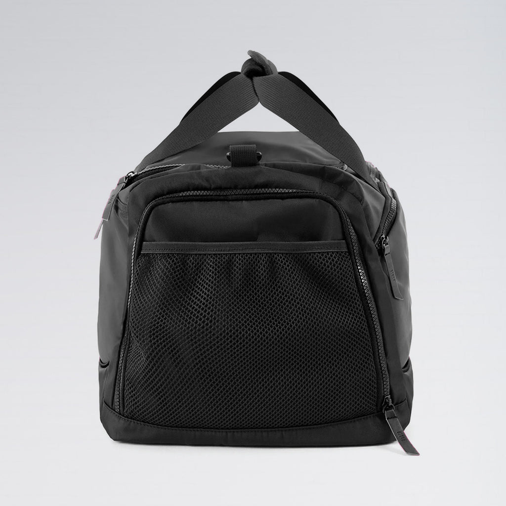 Black duffel bag on a light gray background