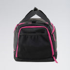 Black duffel bag with pink zippers on a light gray background