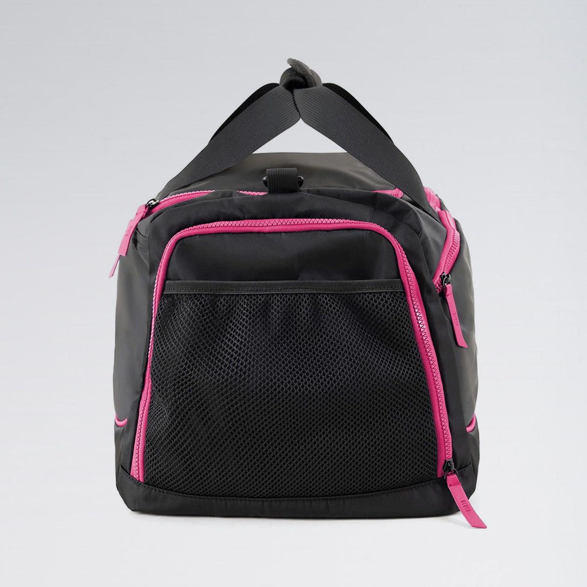 Black duffel bag with pink zippers on a light gray background