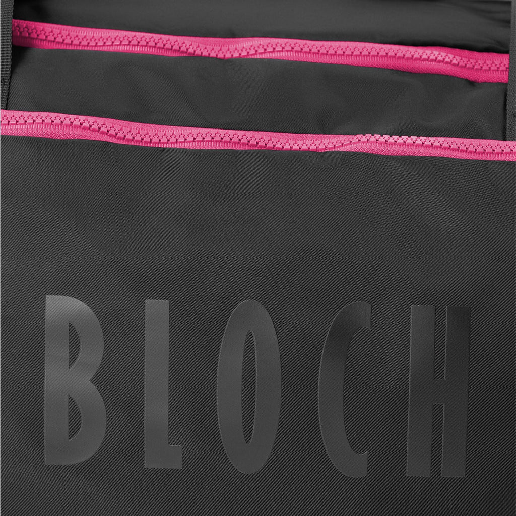 Black bag with pink zipper and 'BLOCH' branding