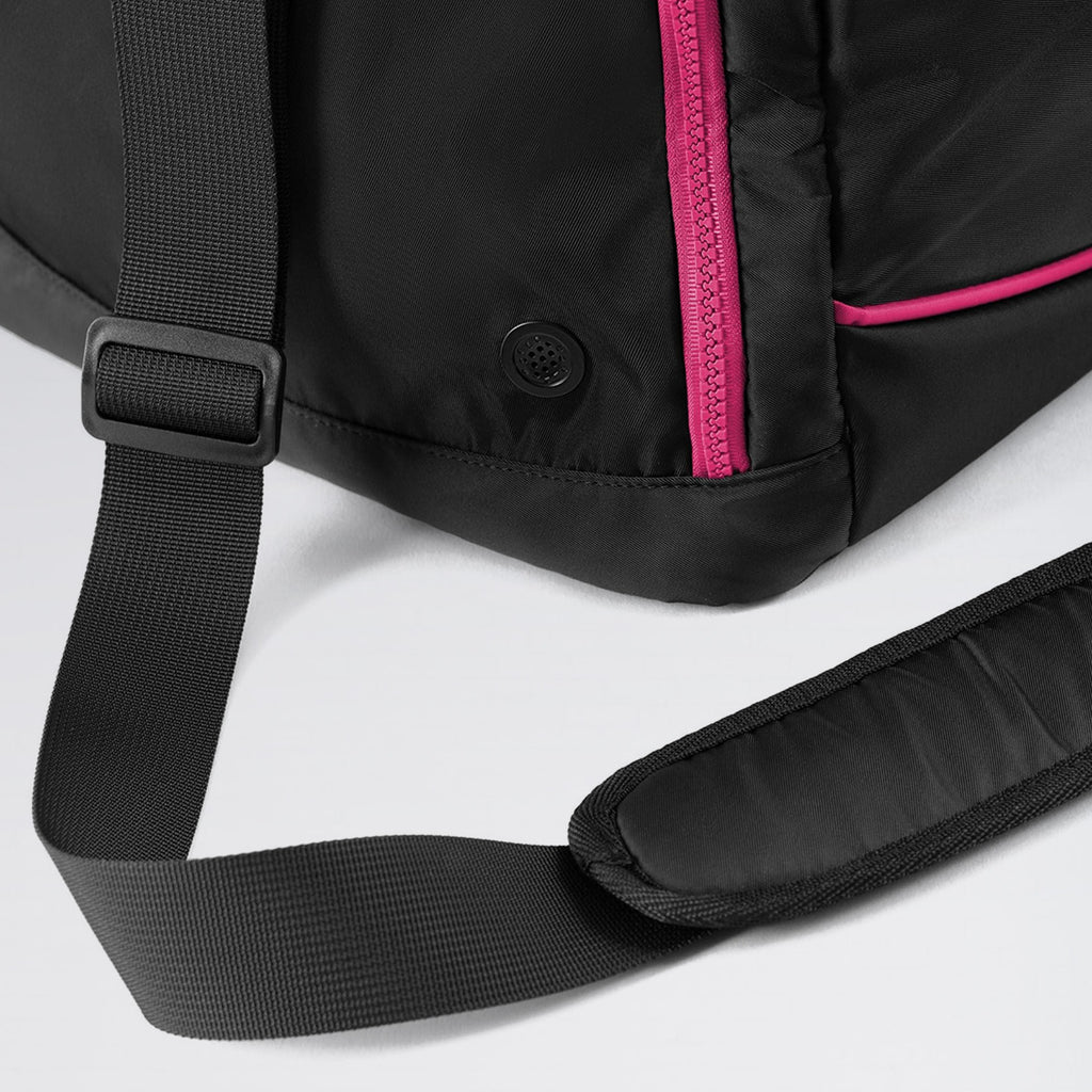 Black backpack with pink zipper on a light gray background
