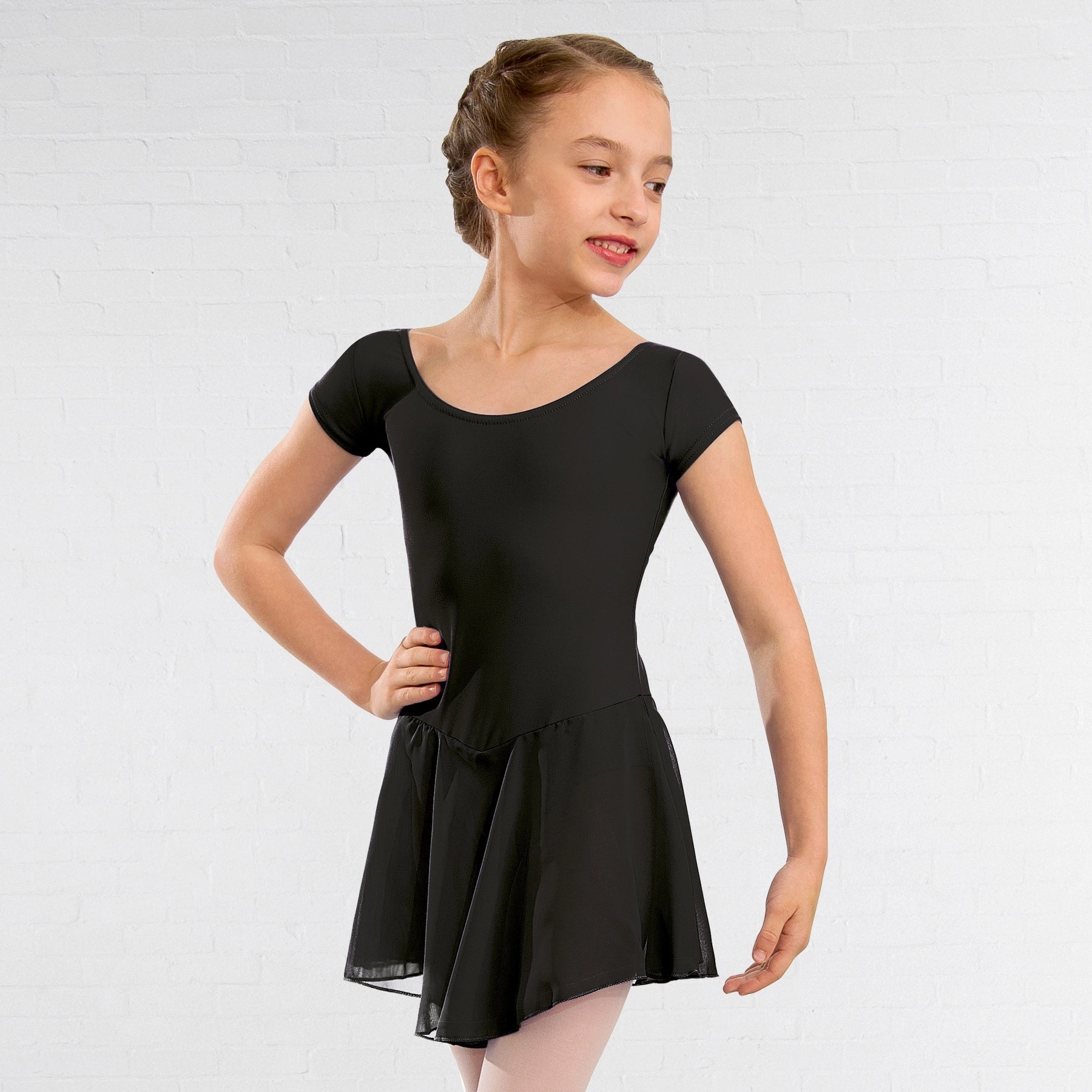 Young girl wearing a black dress on a white background