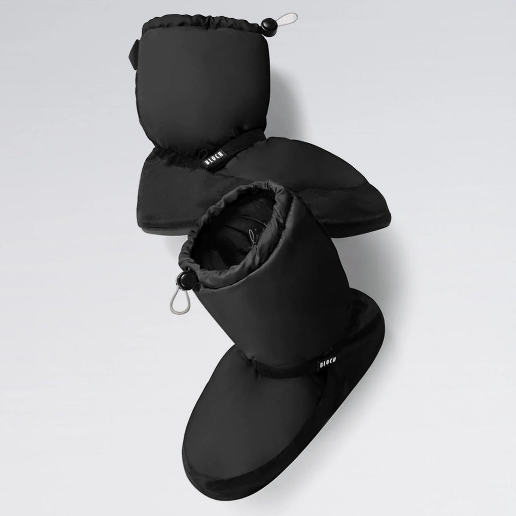 Black booties with hoods on a light gray background