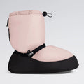Pink and black foot warmer with drawstring on a light gray background