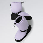 Pair of purple and black baby booties on a light gray background