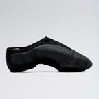 Black leather ballet shoe on a light gray background