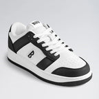 White and black sneaker with brand logo on a light gray background