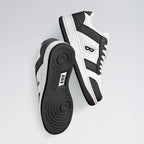 Black and white sneakers with a brand logo on a light gray background