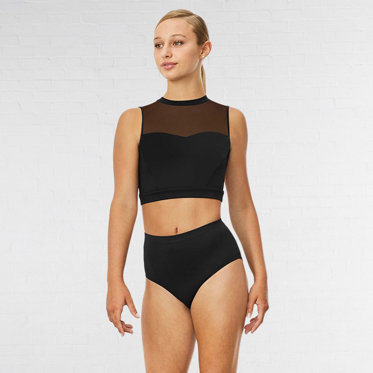 Woman wearing a black bikini with mesh panels on a white background