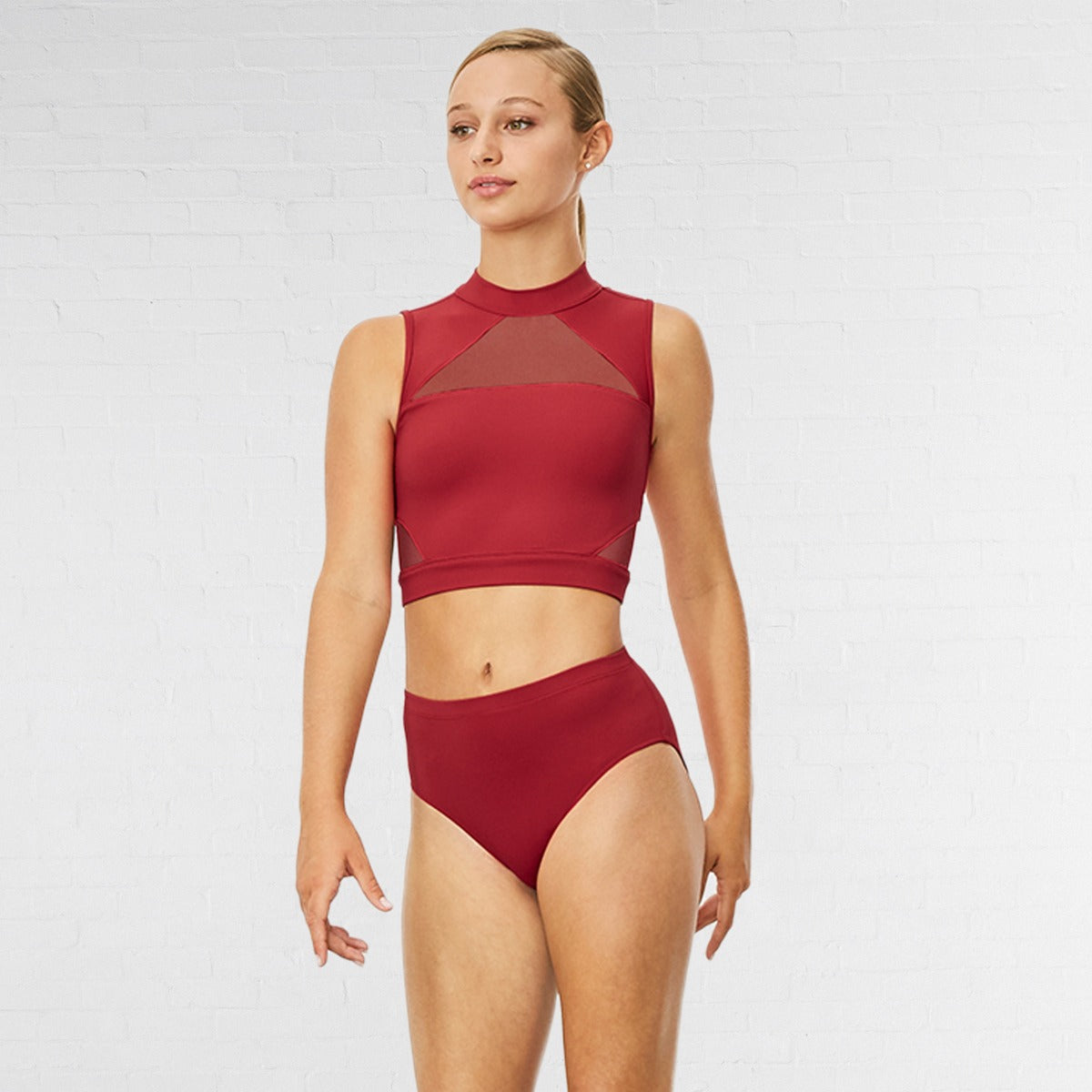 Woman wearing a red bikini set on a white background