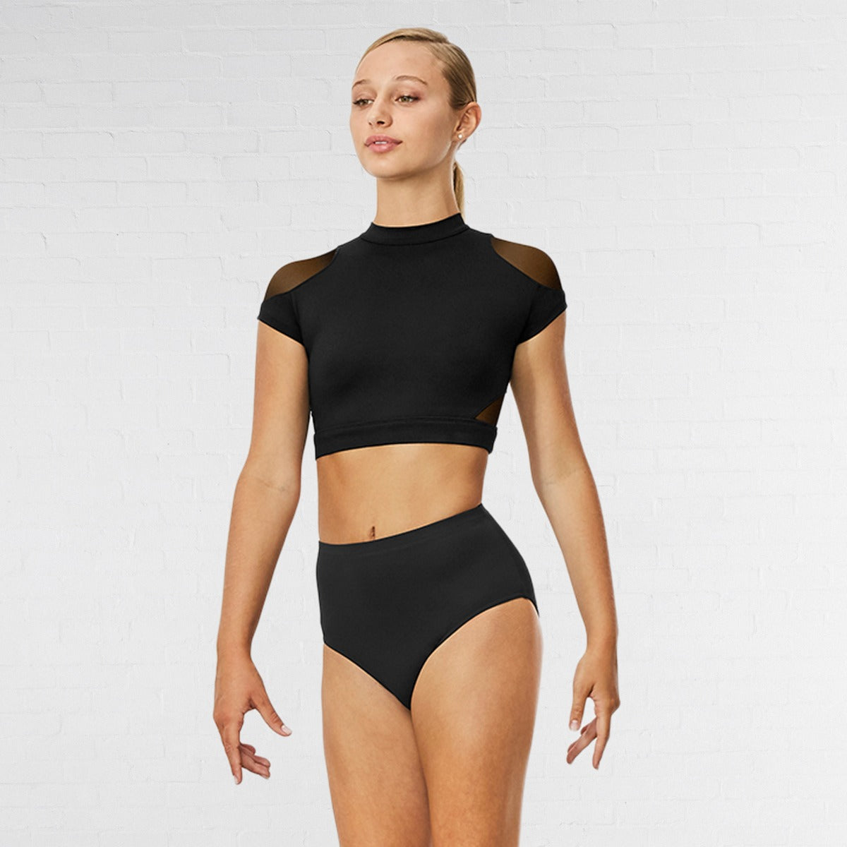 Woman wearing a black two-piece swimsuit on a white background