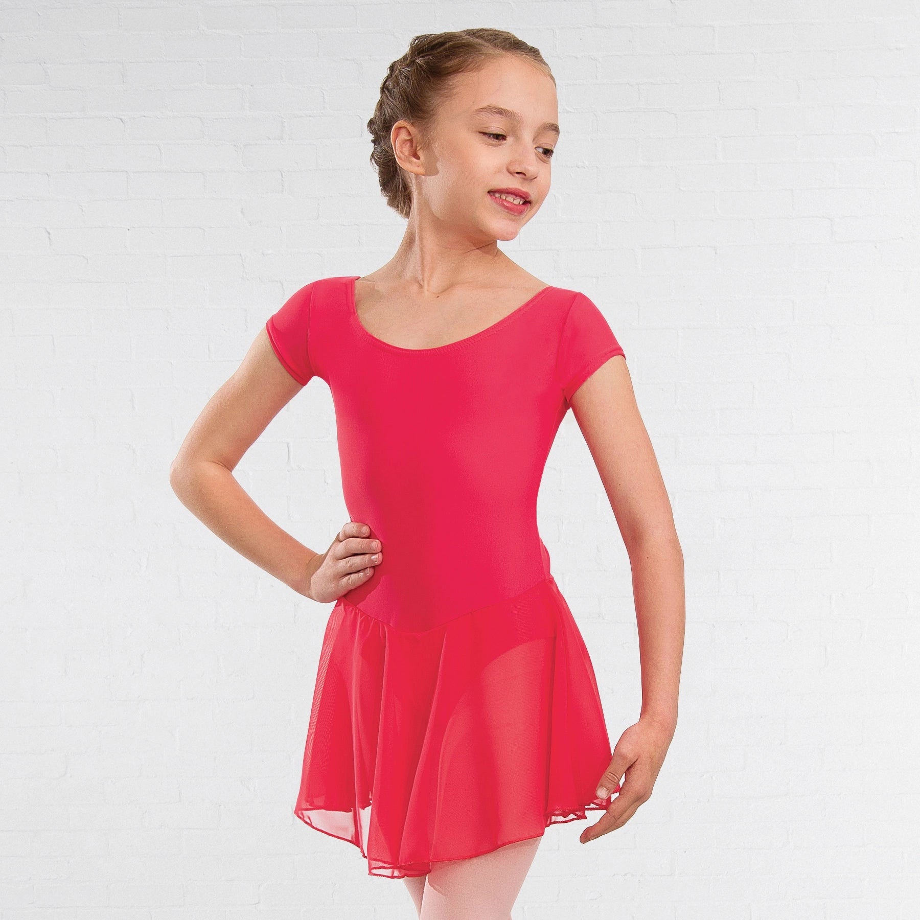 Young girl wearing a red dress on a white background