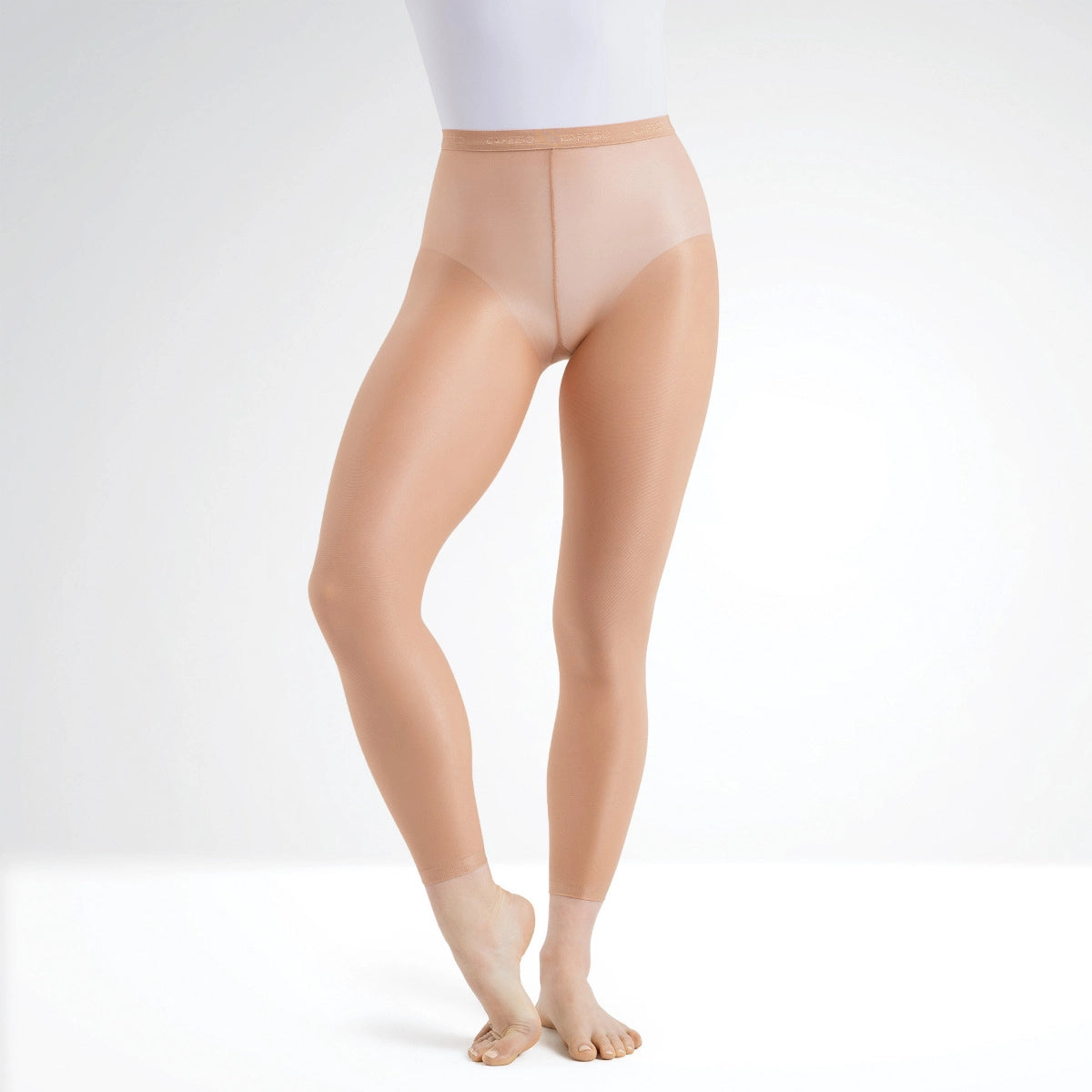 Beige tights worn by a person on a white background