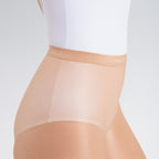Beige shapewear worn over a white top on a light gray background