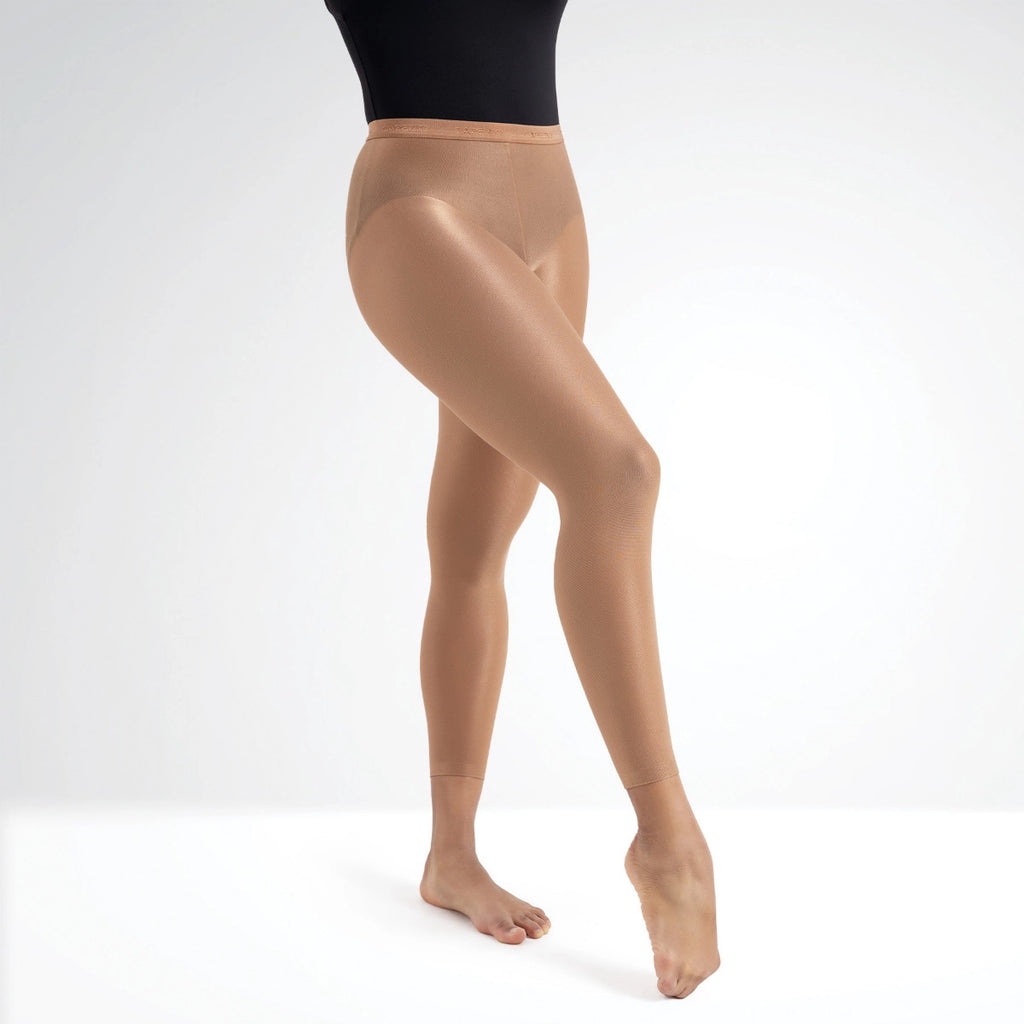 Beige tights worn by a person on a white background