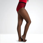 Brown fishnet stockings worn with a red top on a white background