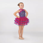 Young dancer wearing a raspberry pink sequin tutu costume by 1st Position featuring a crossover halterneck design, sparkling sequin bodice and layered tutu skirt with blue glitter trim.