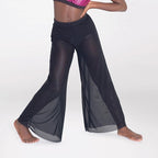 Dancer in a pink top and black pants posing on a white background