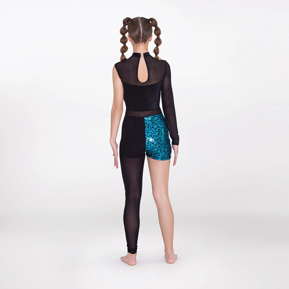 A child model shown from the back wearing a black long-sleeve leotard with a sheer mesh back panel and black tights, paired with teal patterned shorts, against a plain light gray studio background.