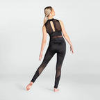 A woman modeling a black activewear set consisting of a sleeveless mesh-back top and matching high-waisted leggings with sheer mesh side panels, shown from the back against a light gray studio background.