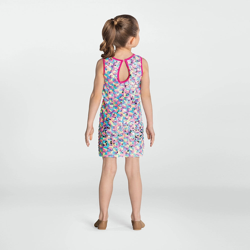 Girl wearing a colorful patterned dress on a white background