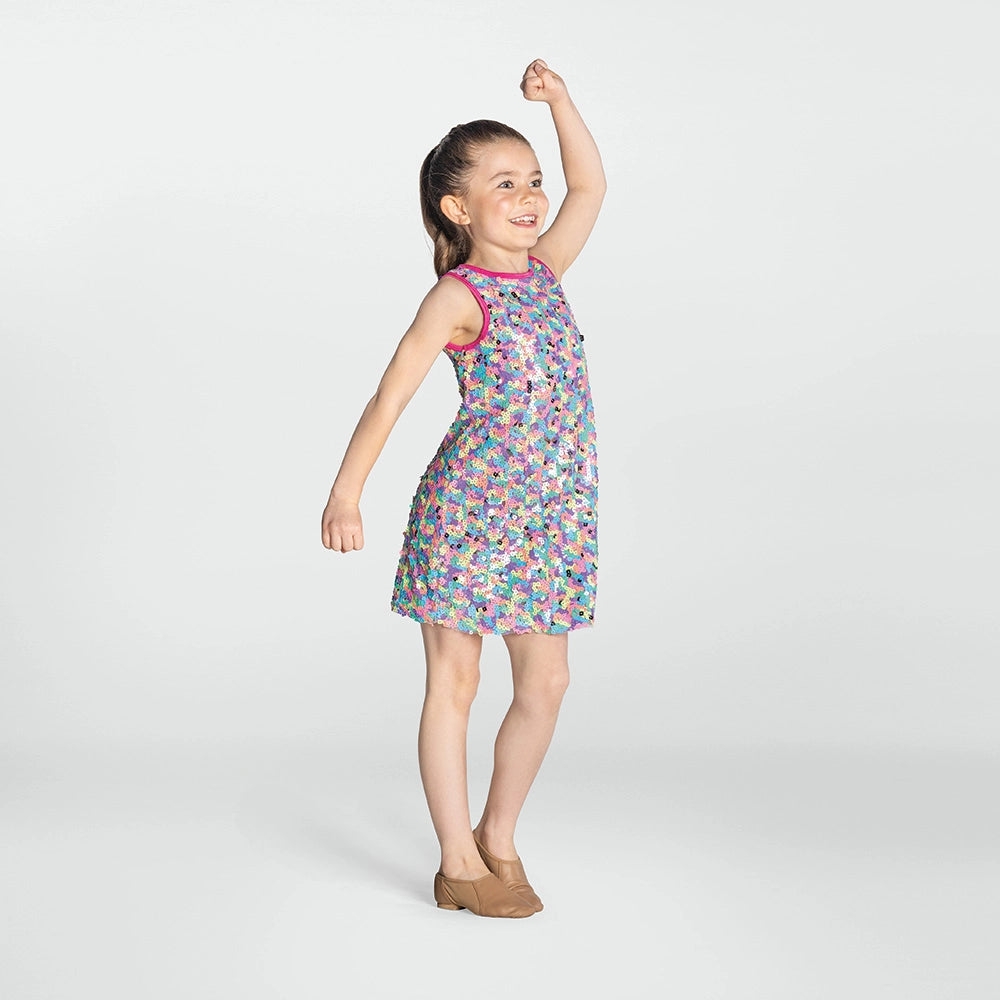 Young girl wearing a colorful patterned dress on a white background