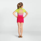 Young girl wearing a colorful dress with a gradient from green to pink on a white background