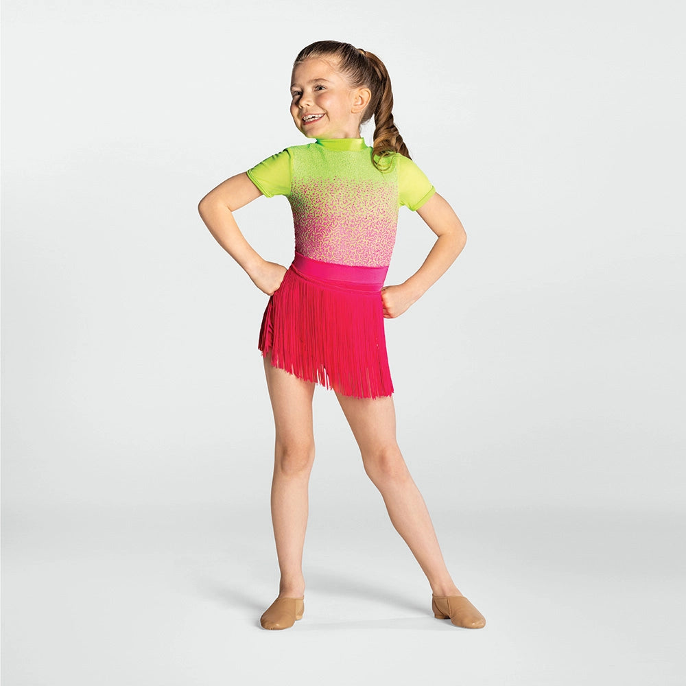 Young girl in a colorful outfit with a gradient top and pink fringed skirt on a white background