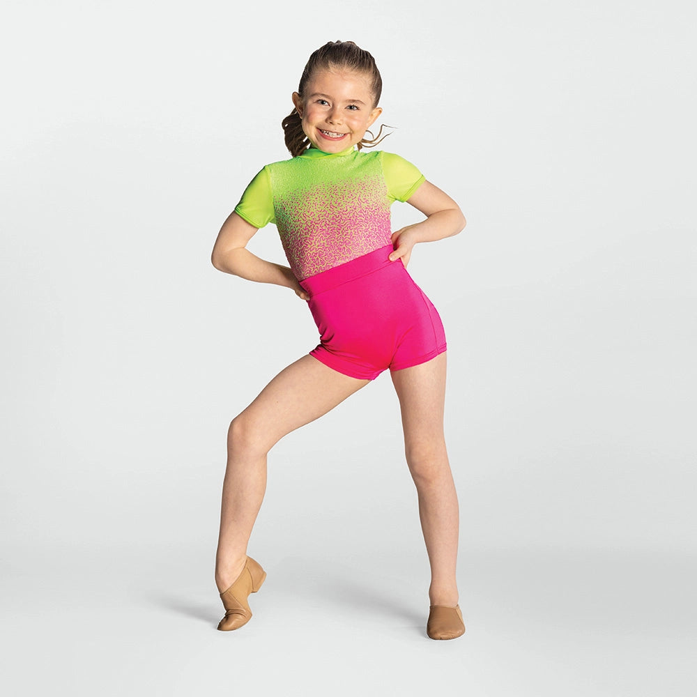 Young girl in a colorful leotard posing on a white background