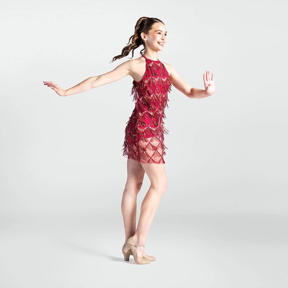 Dancer in a red dress with feather details on a white background