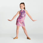 Young girl wearing a colorful dress on a white background