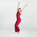 Dancer in a red outfit with ruffled pants and embellished top on a white background