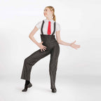 A woman modeling a costume consisting of black and white pinstriped suspenders, a white short-sleeve collared shirt, and a red necktie, posed against a plain white studio background.