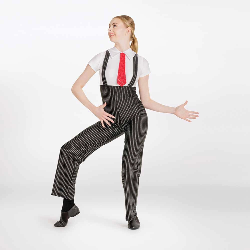 A woman modeling a costume consisting of black and white pinstriped suspenders, a white short-sleeve collared shirt, and a red necktie, posed against a plain white studio background.