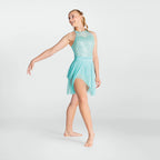 Person wearing a turquoise dance outfit on a white background