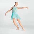 Dancer in a light blue dress posing on a white background