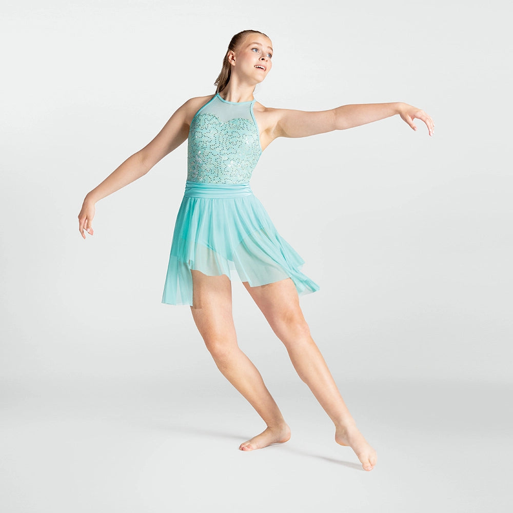 Dancer in a light blue dress posing on a white background