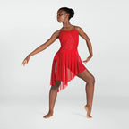 Dancer in a red dress posing on a white background