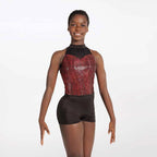 Person wearing a black and red sequined leotard on a white background