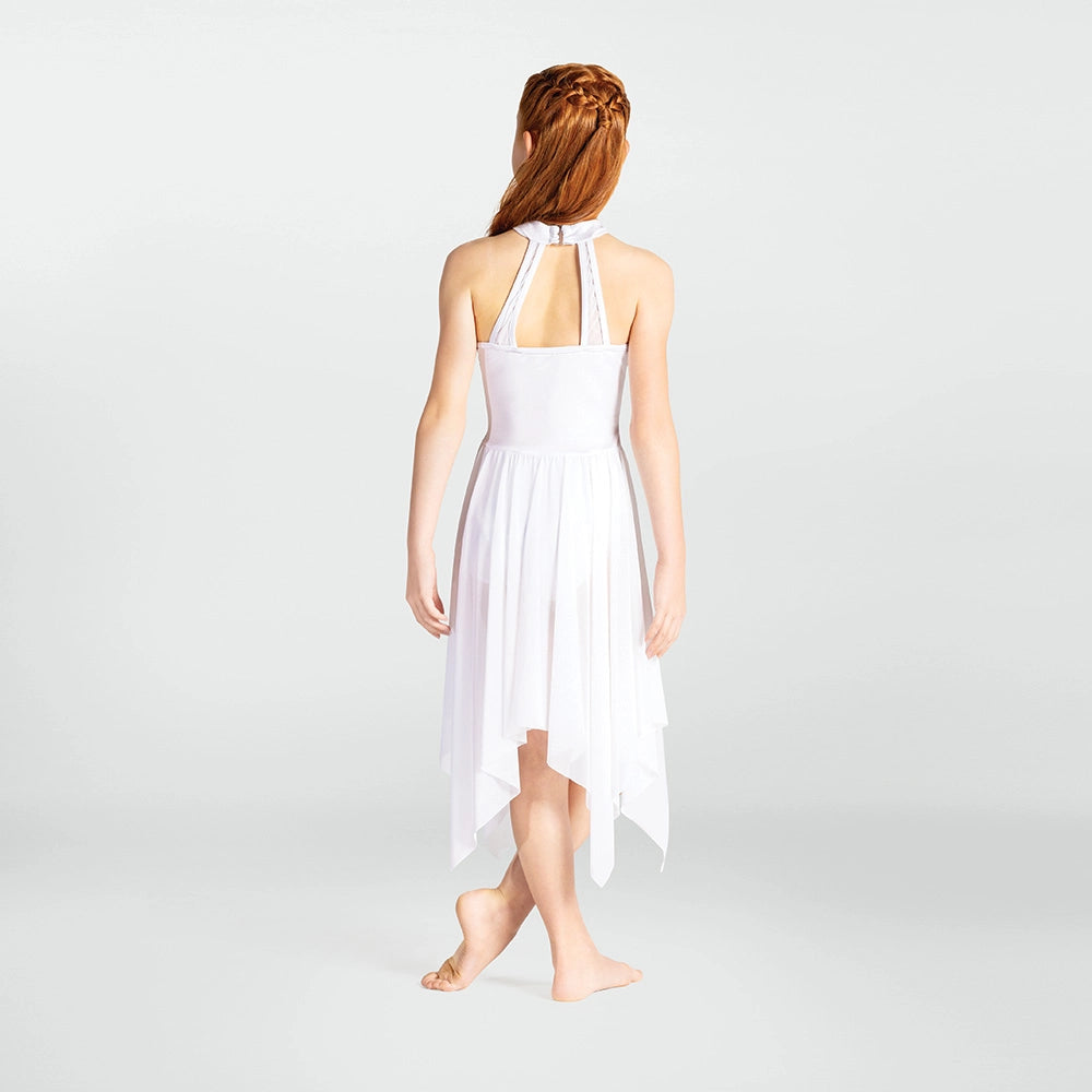 Woman wearing a white dress on a plain background
