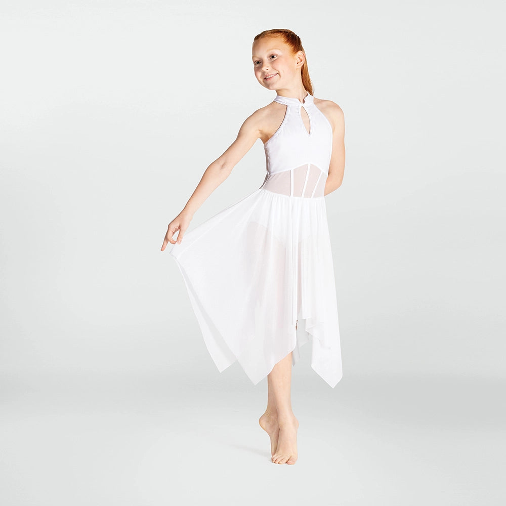 Woman wearing a white dress against a plain background