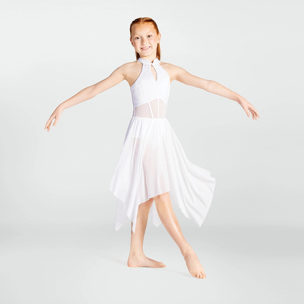 Young girl in a white dress posing against a light gray background